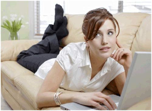 woman on her computer looking at online dating profile examples