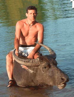 JT Pierce riding a water buffalo